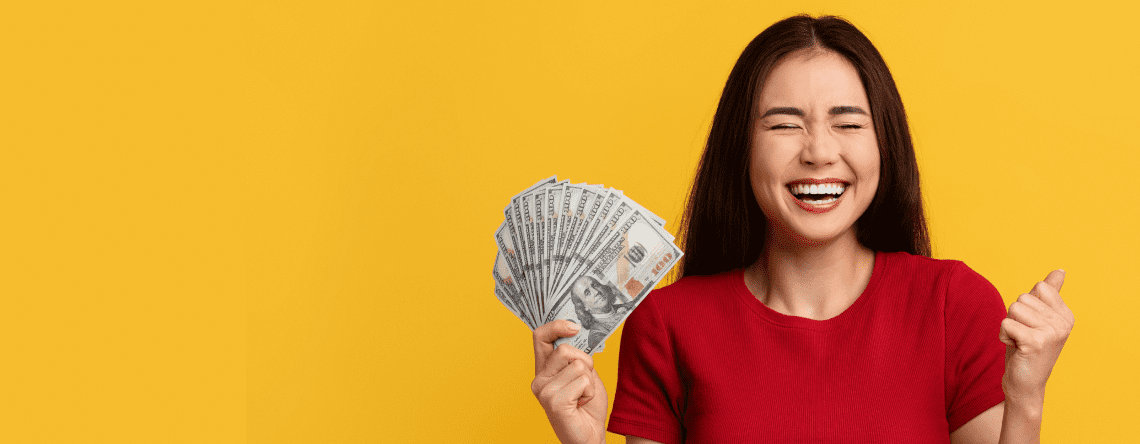 a person holding a fan of money